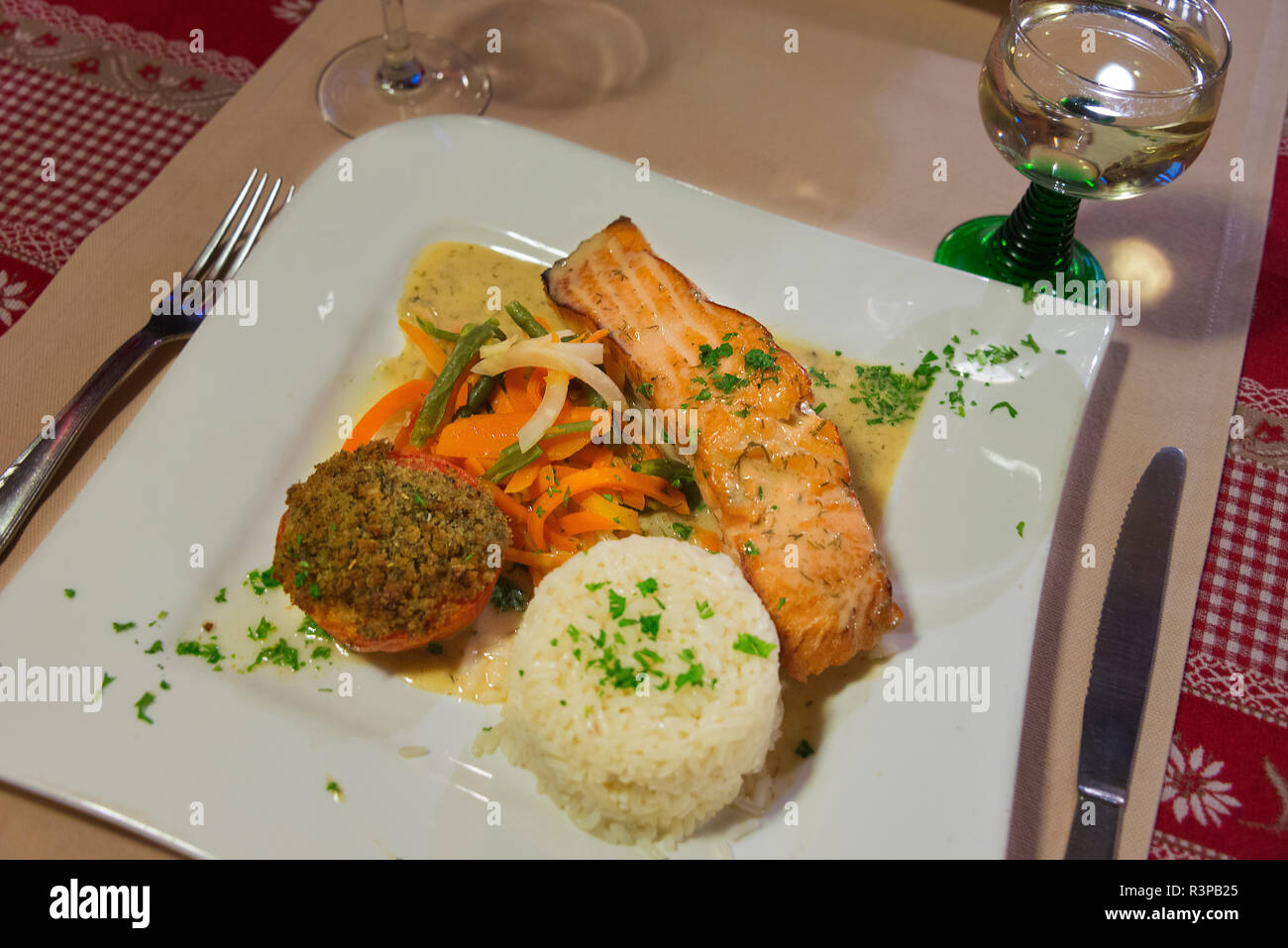 France, Alsace, Eguisheim. Grilled salmon dish served in small restaurant in Equisheim village. Stock Photo