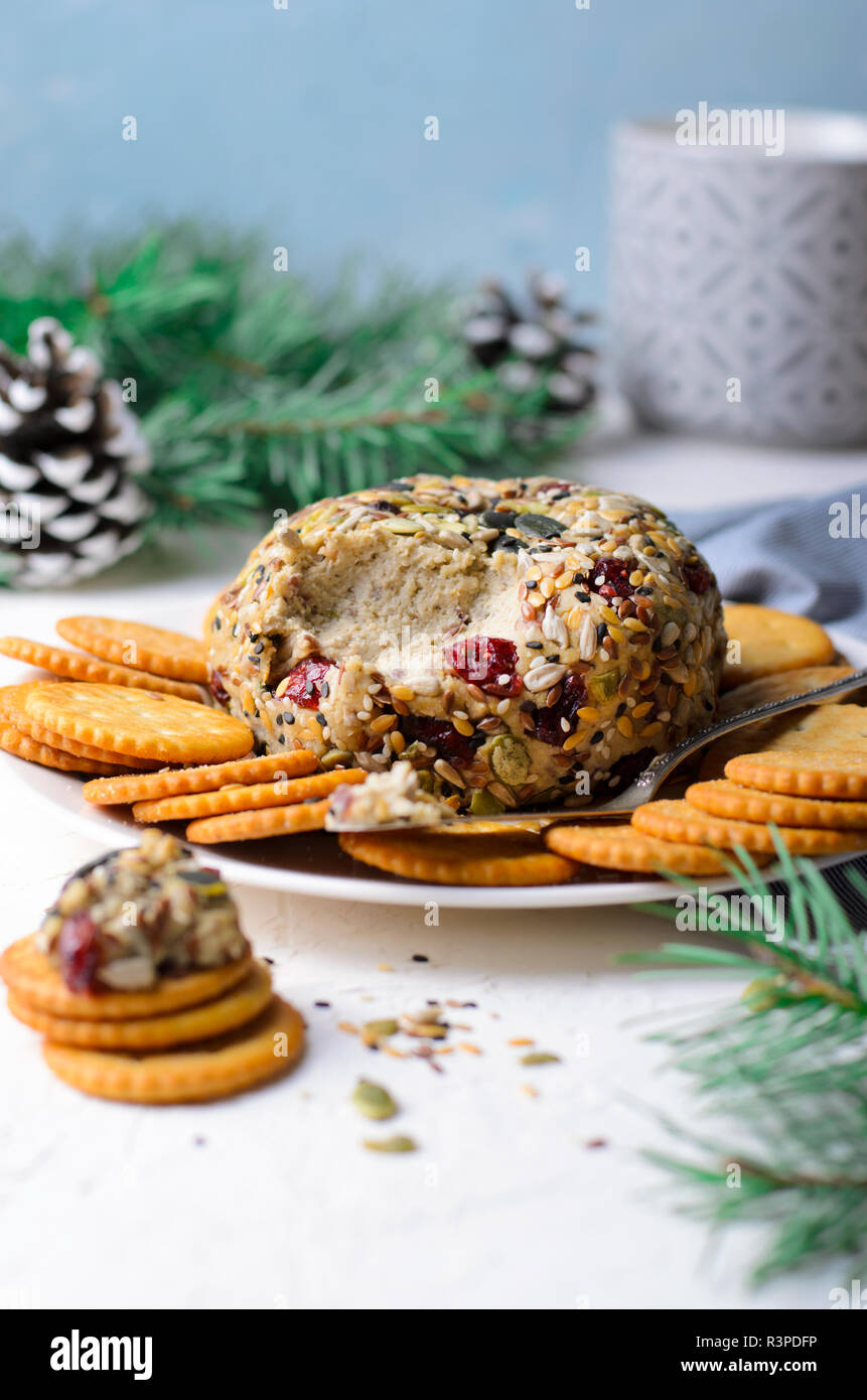 Vegan Cheese Ball Appetizer Served with Crackers, Hummus or Nut Butter Spread Stock Photo