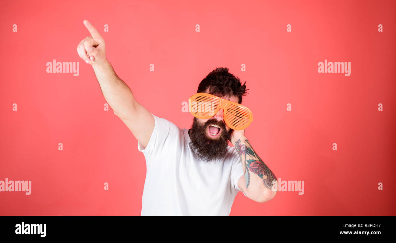 Man bearded hipster dj wears giant louvered sunglasses. Sunglasses