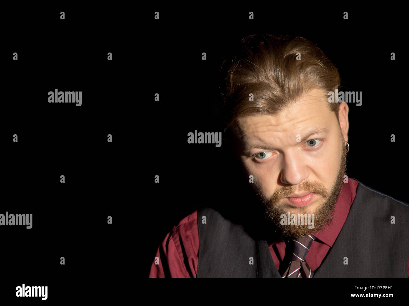 image of a man with a beard on a black background Stock Photo