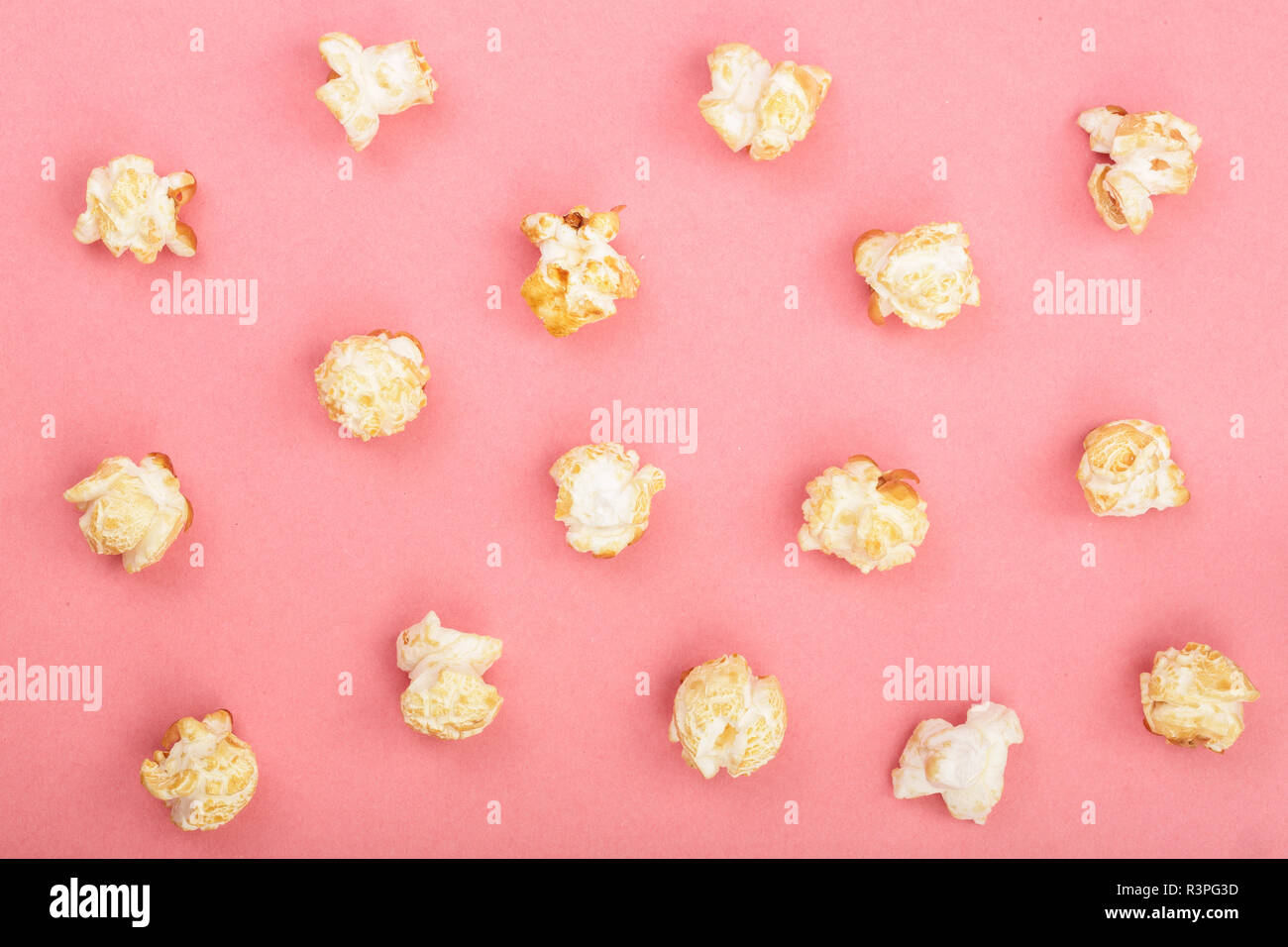 Popcorn on red background. Top view. Flat lay pattern Stock Photo
