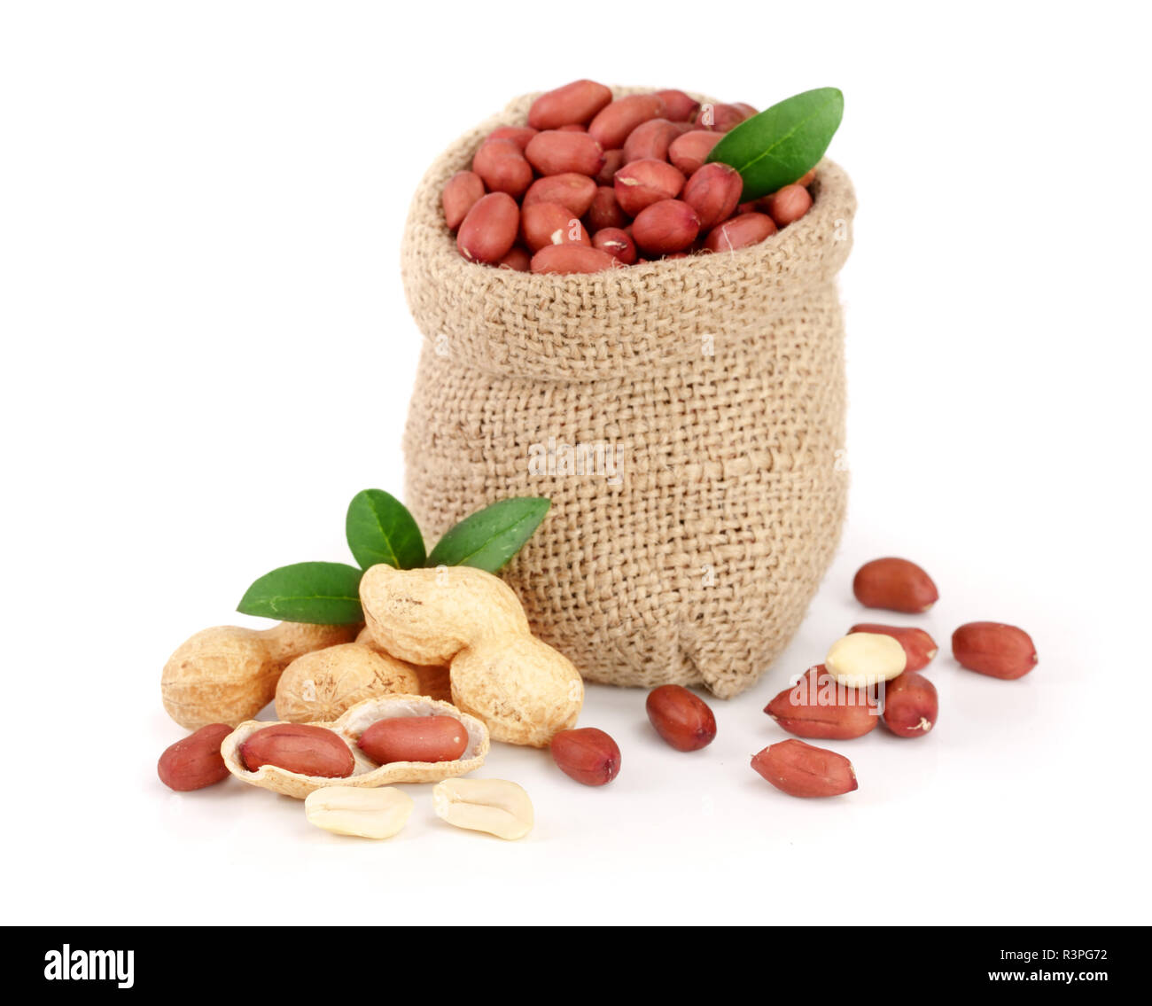 peanuts with leaf in bag isolated on white background Stock Photo