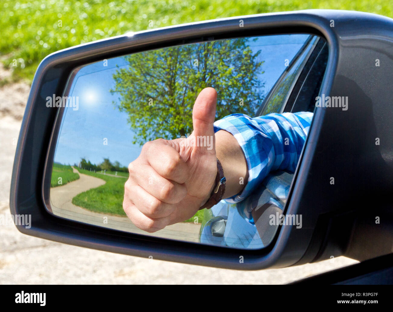 motorists with thumbs up Stock Photo - Alamy