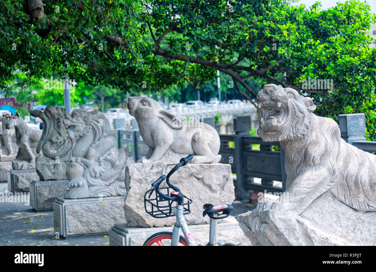 Chinese zodiac animal statues along a water canal in the longhua