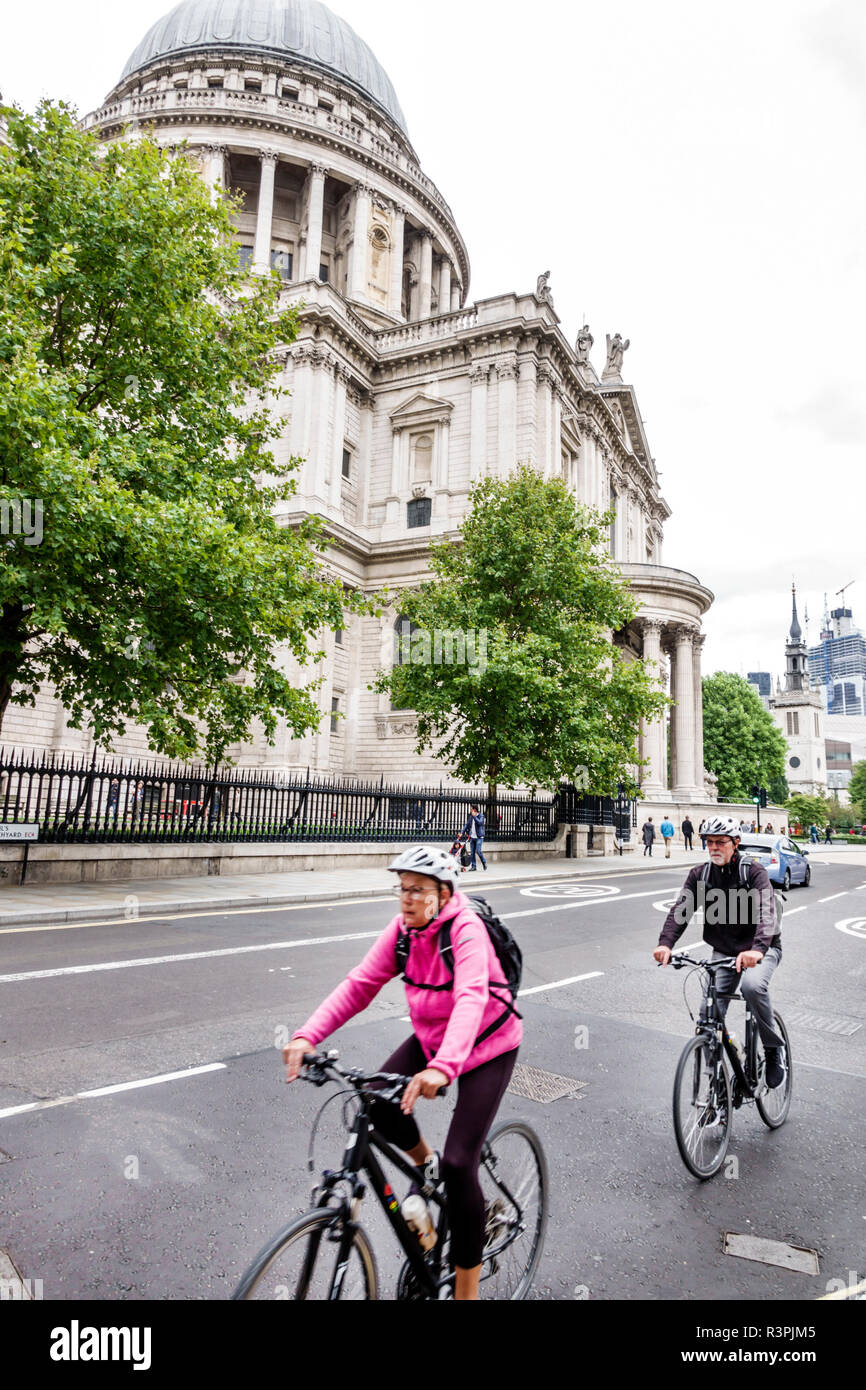 City of London England,UK Ludgate Hill,St Paul's Cathedral,mother church,Anglican,religion,historic,Grade I listed,dome,exterior,cyclist,bicycles,man Stock Photo