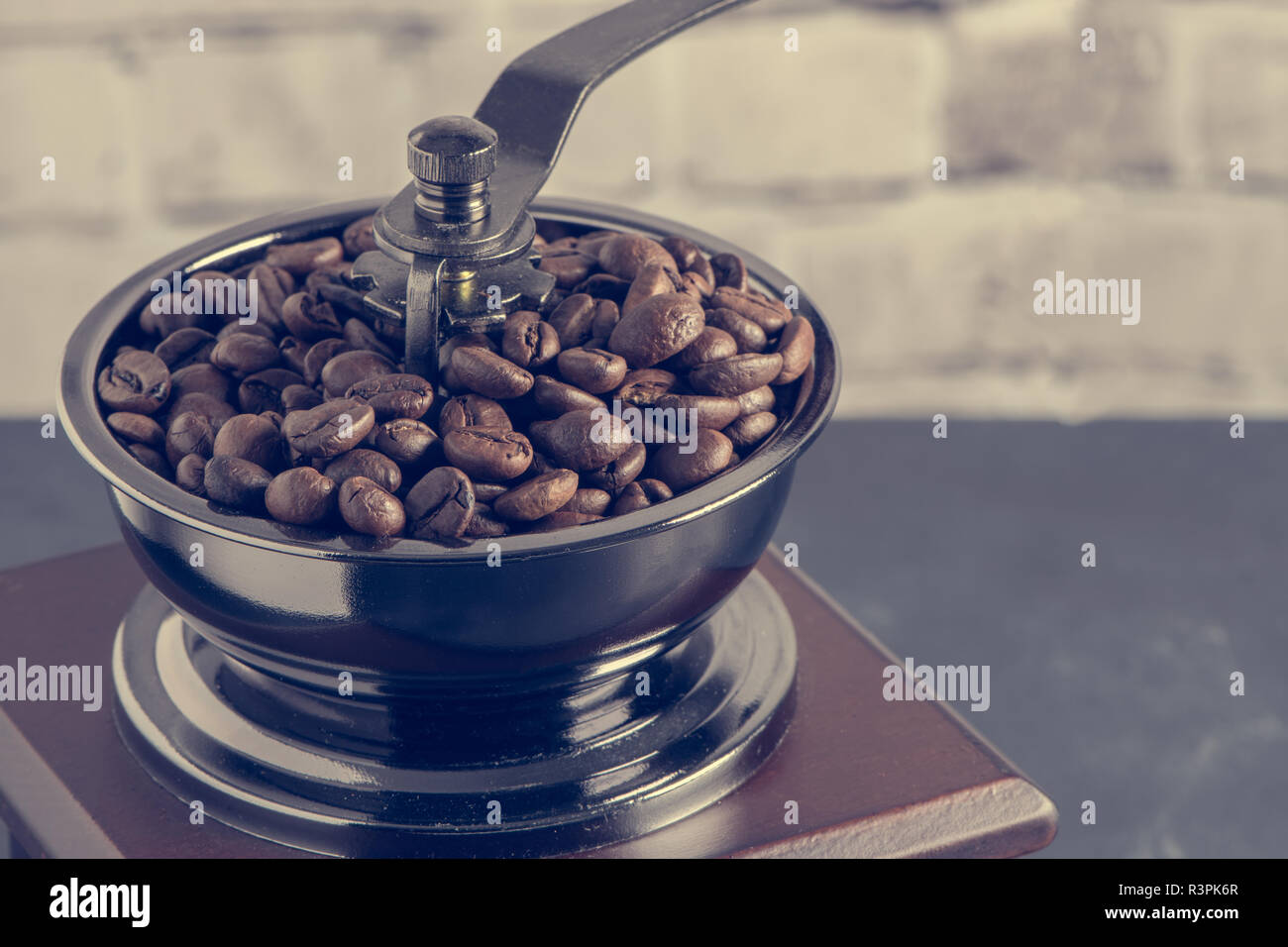 Vintage manual coffee grinder on table 