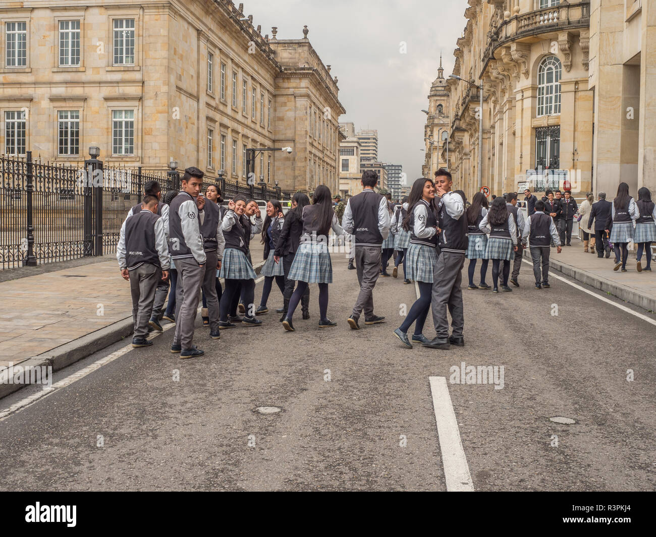 Bogota, Colombia - September 13, 2013: Young people in blue school uniform on the street of Bogota, next to Casa de Nariño, La Candelaria. Stock Photo