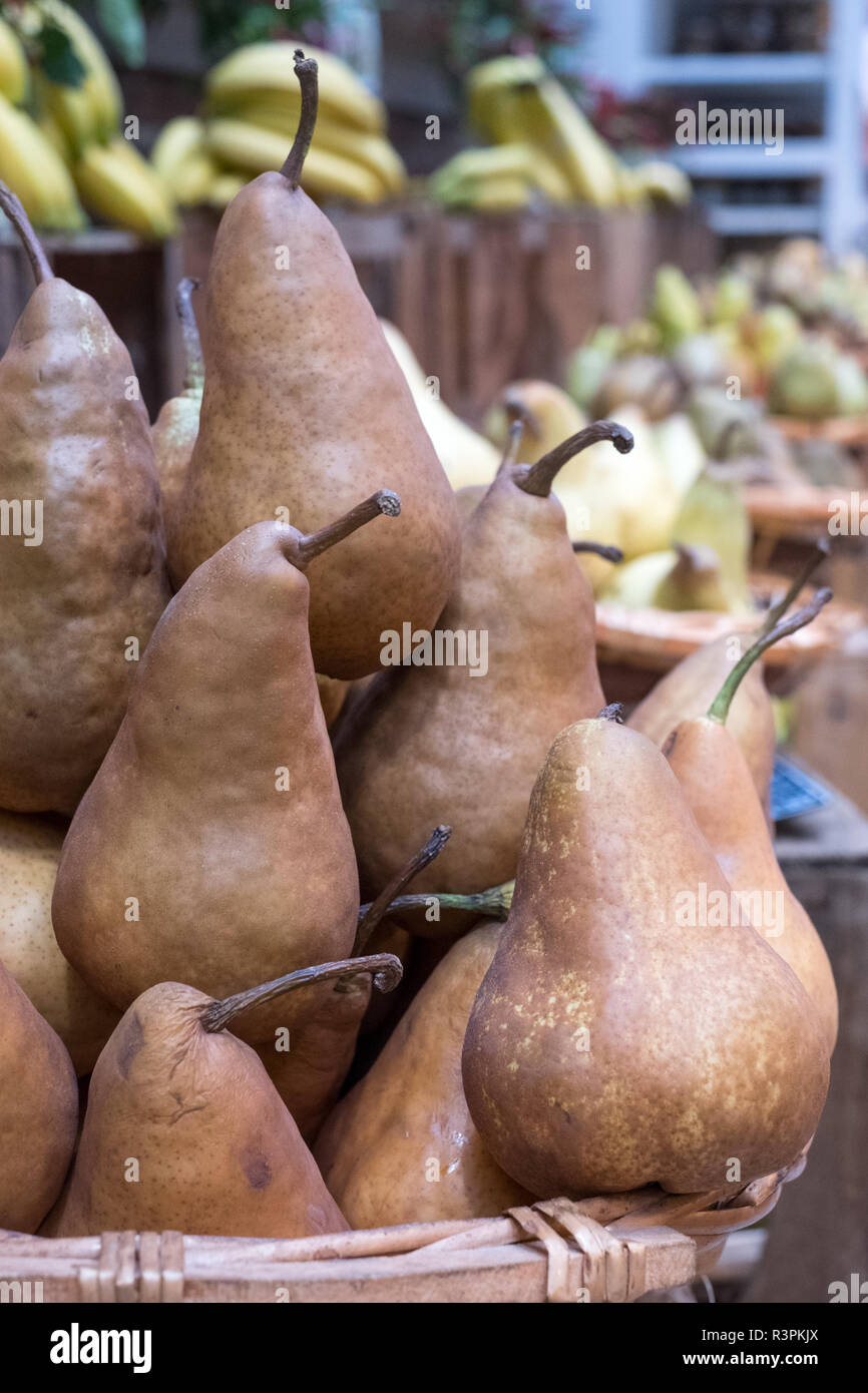 Variety of pears on sale in baskets at Eataly highend food market in