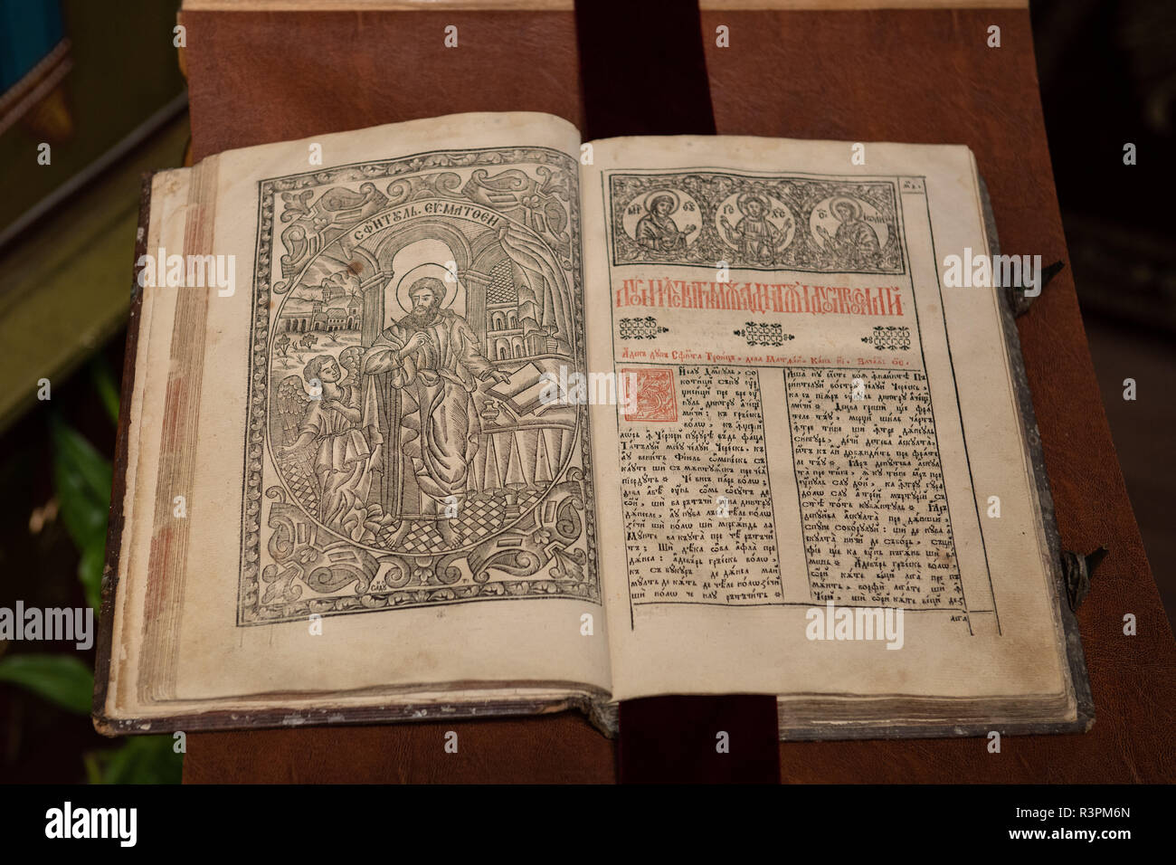 Old Christian manuscript written in Cyrillic on church pulpit. Stock Photo