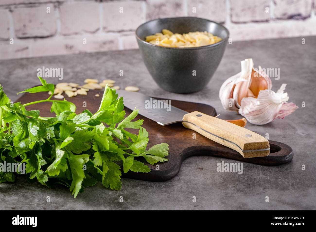 Fresh Garden Herbs On Kitchen Countertop Parsley Garlic Knife