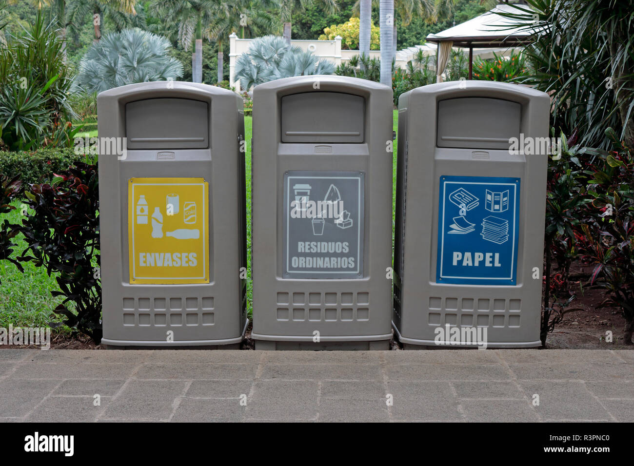 A group of three typical recycling waste bins in Costa Rica Stock Photo