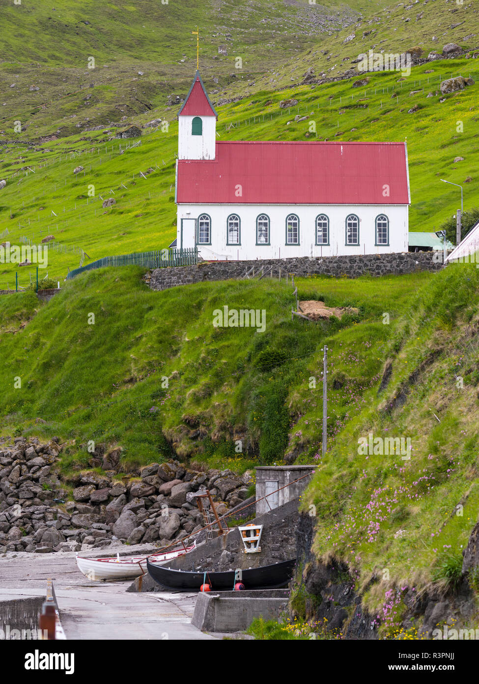 The island of Kunoy with village Kunoy and church. Faroe Islands, Denmark Stock Photo