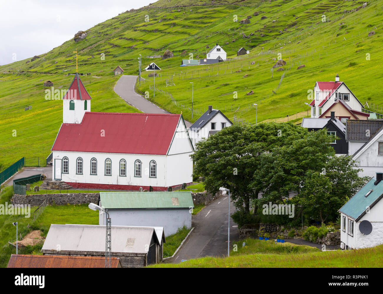 The island of Kunoy with village Kunoy and church. Faroe Islands, Denmark Stock Photo