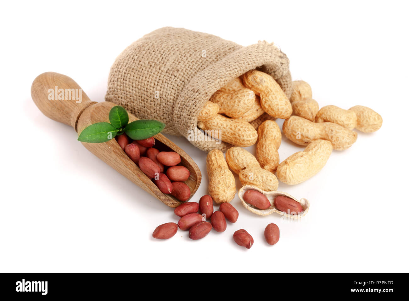 peanuts with leaf in bag isolated on white background Stock Photo
