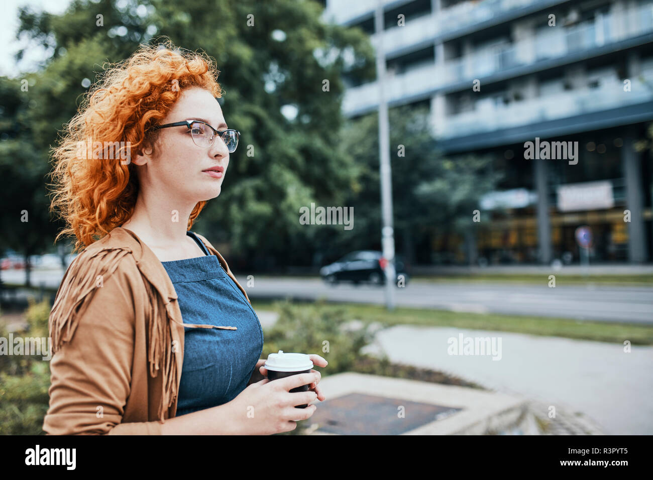 Woman going to work with a take out coffee Stock Photo