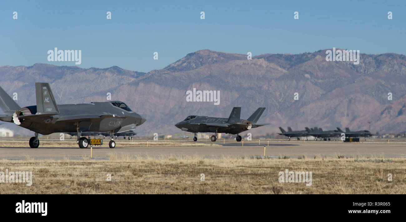 F35A Lightning II aircraft  assigned to the 338th and 419th Fighter Wings at Hill AFB, Utah taxi to the base's runway to participate in a Combat Power Exercise held 19 November, 2018. The historic exercise was meant ot demonstrate the Fighter Wings ability to quickly employ a large force of combat jets against air and ground targets. Stock Photo