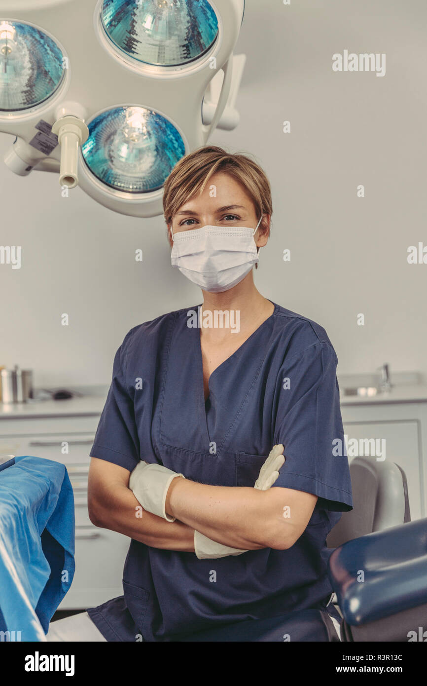 Dental surgeon wearing surgical mask, portrait Stock Photo Alamy