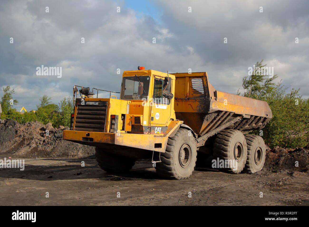 Caterpillar 400D Articulated dump trucks that worked on the old Recycoal Coal Recycling Plant in Rossington,Doncaster Stock Photo