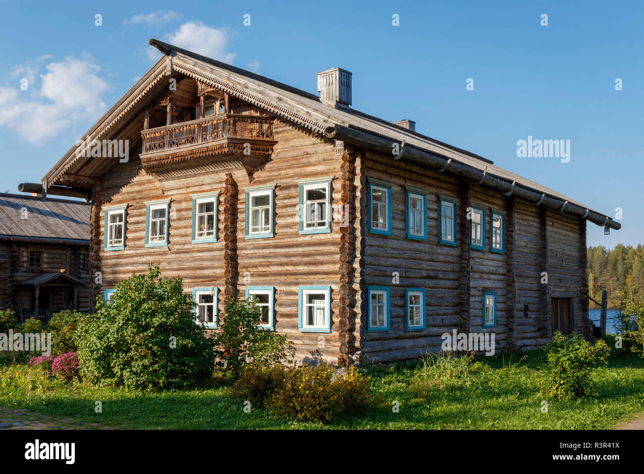 A large multi-purpose wooden building recontructed at Verkhniye Mandrogi in Northern Russia. A craft and museum site for tourism on the Svir River. Stock Photo