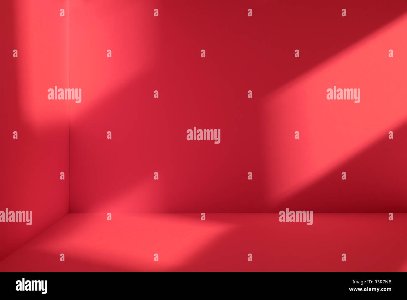 Empty corner of red room with deep window shadow. Minimalistic space concept Stock Photo
