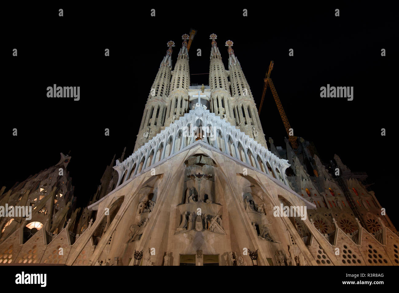 Night view of Passion Façade of Sagrada Familia, the cathedral designed by Gaudi in Barcelona, Spain Stock Photo