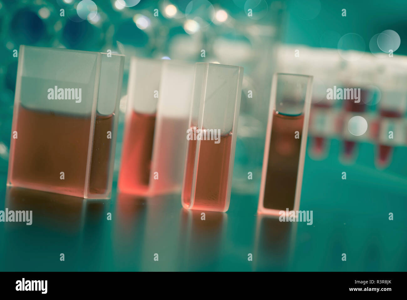 Quartz cuvettes containing red liquid Stock Photo Alamy