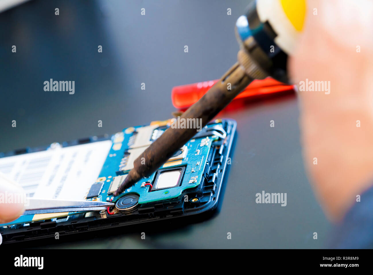 Mobile phone repair Stock Photo - Alamy