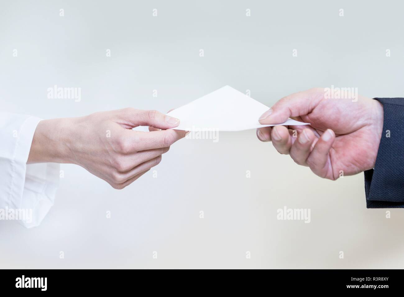 Customer giving prescription to pharmacist in pharmacy. Stock Photo
