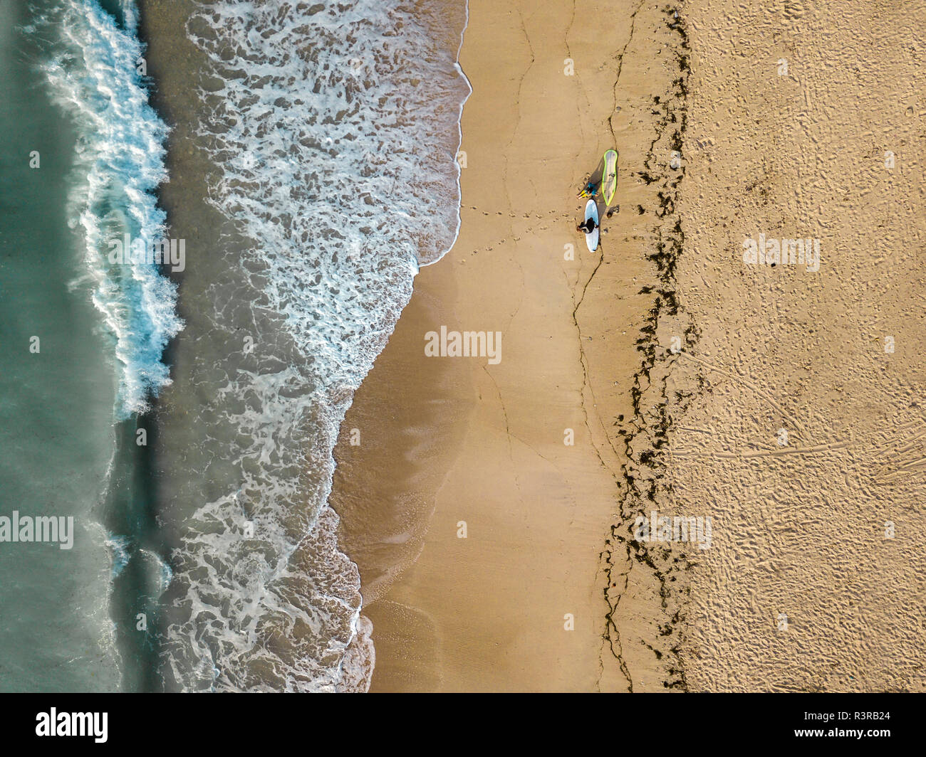 Indonesia, Bali, Aerial view of Pandawa beach, two surfers Stock Photo