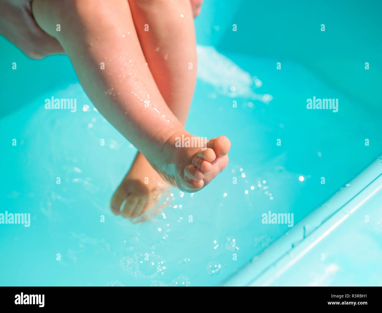 Wet legs of baby girl Stock Photo - Alamy