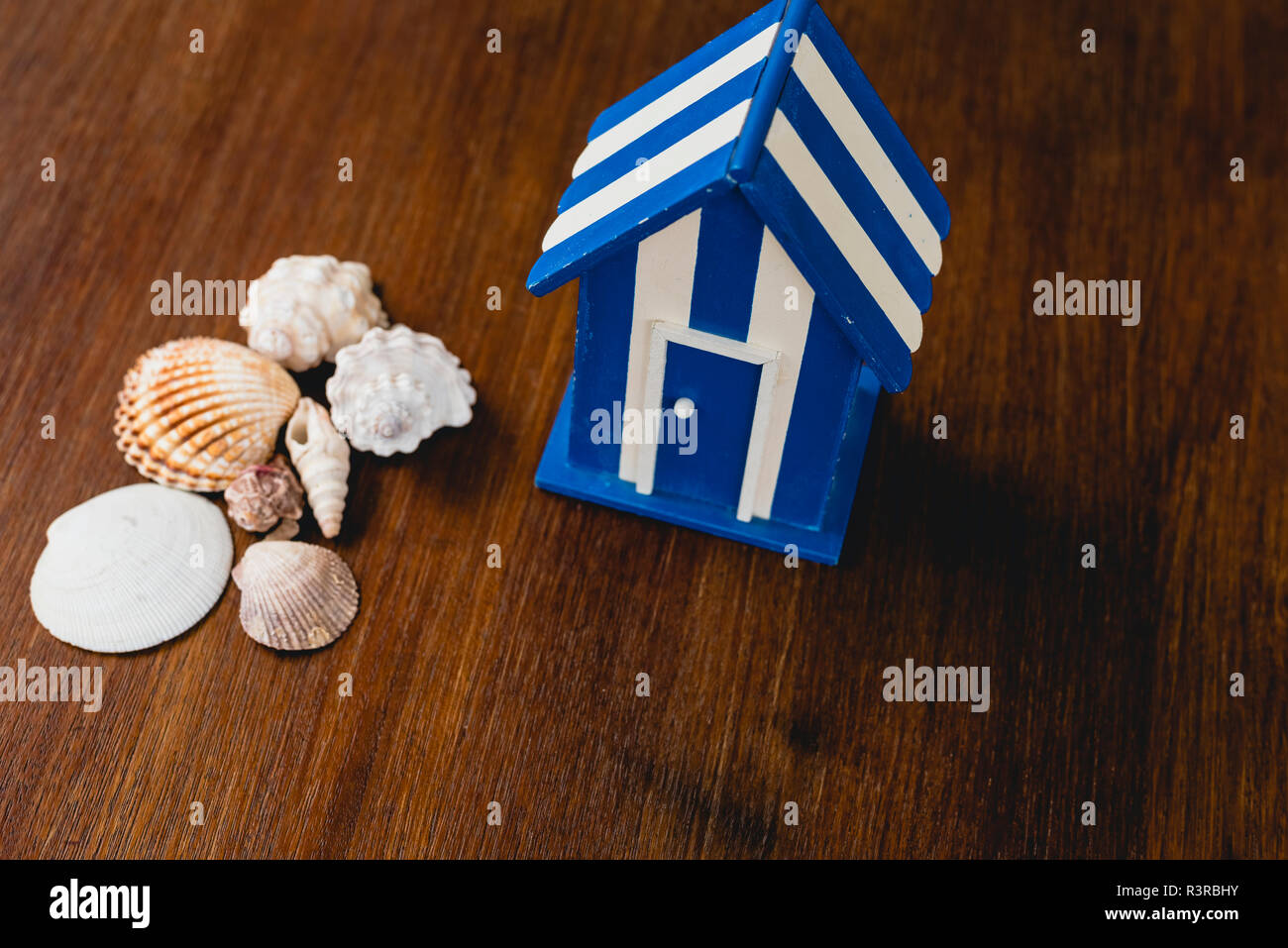 Wooden toy house with beach and maritime motifs Stock Photo Alamy