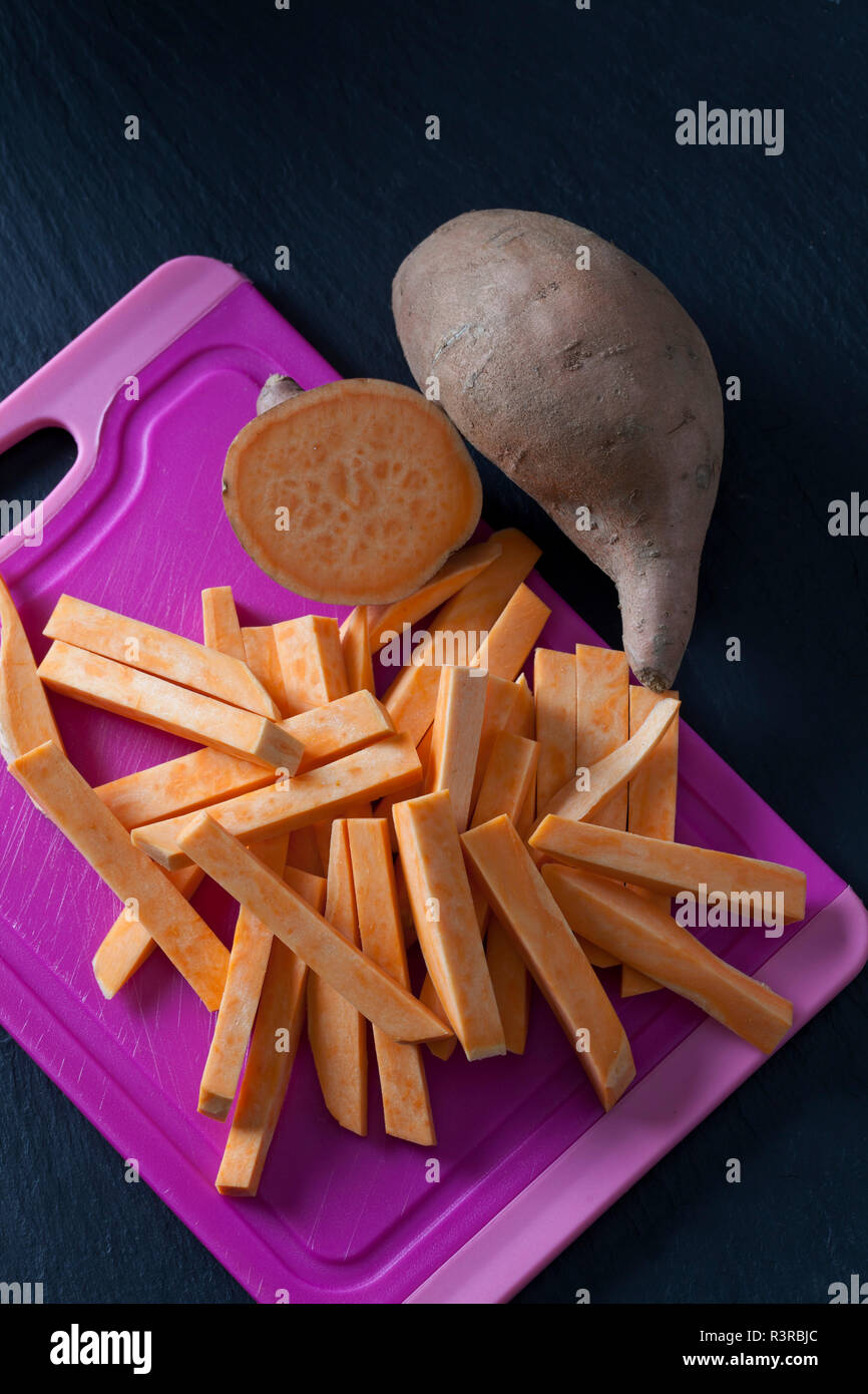 Sliced and whole sweet potato Stock Photo