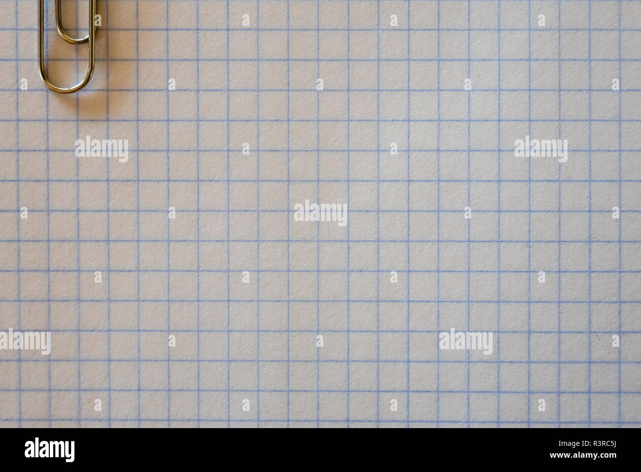 Graph paper with a clip for office work Stock Photo - Alamy
