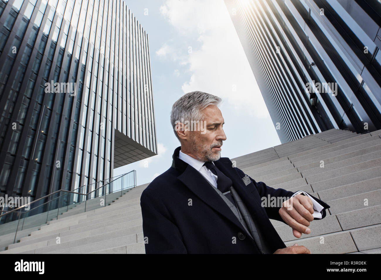 Businessman checking the time Stock Photo