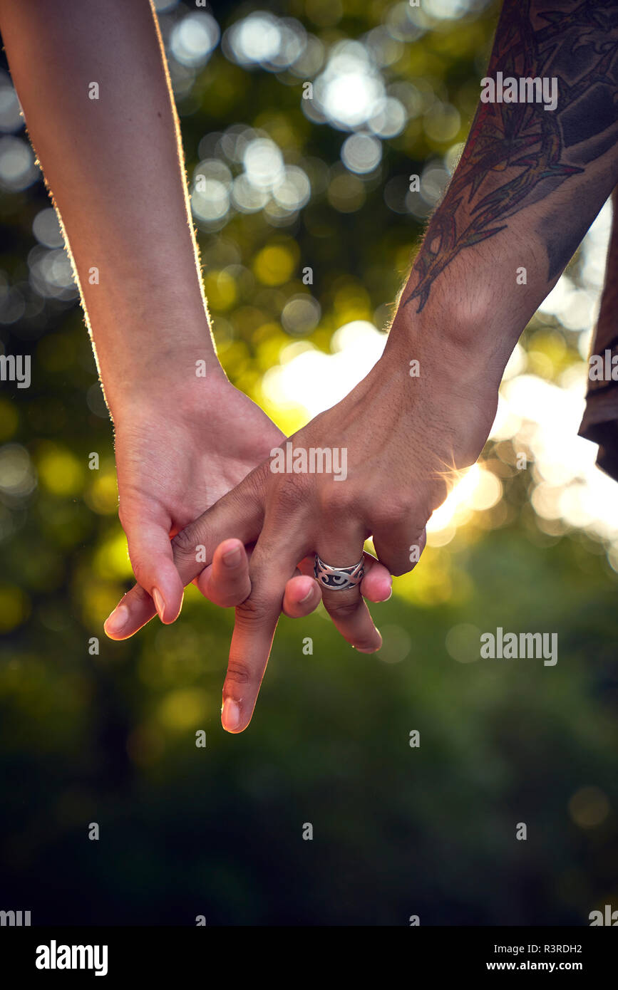Intertwined Hands High Resolution Stock Photography and Images Alamy