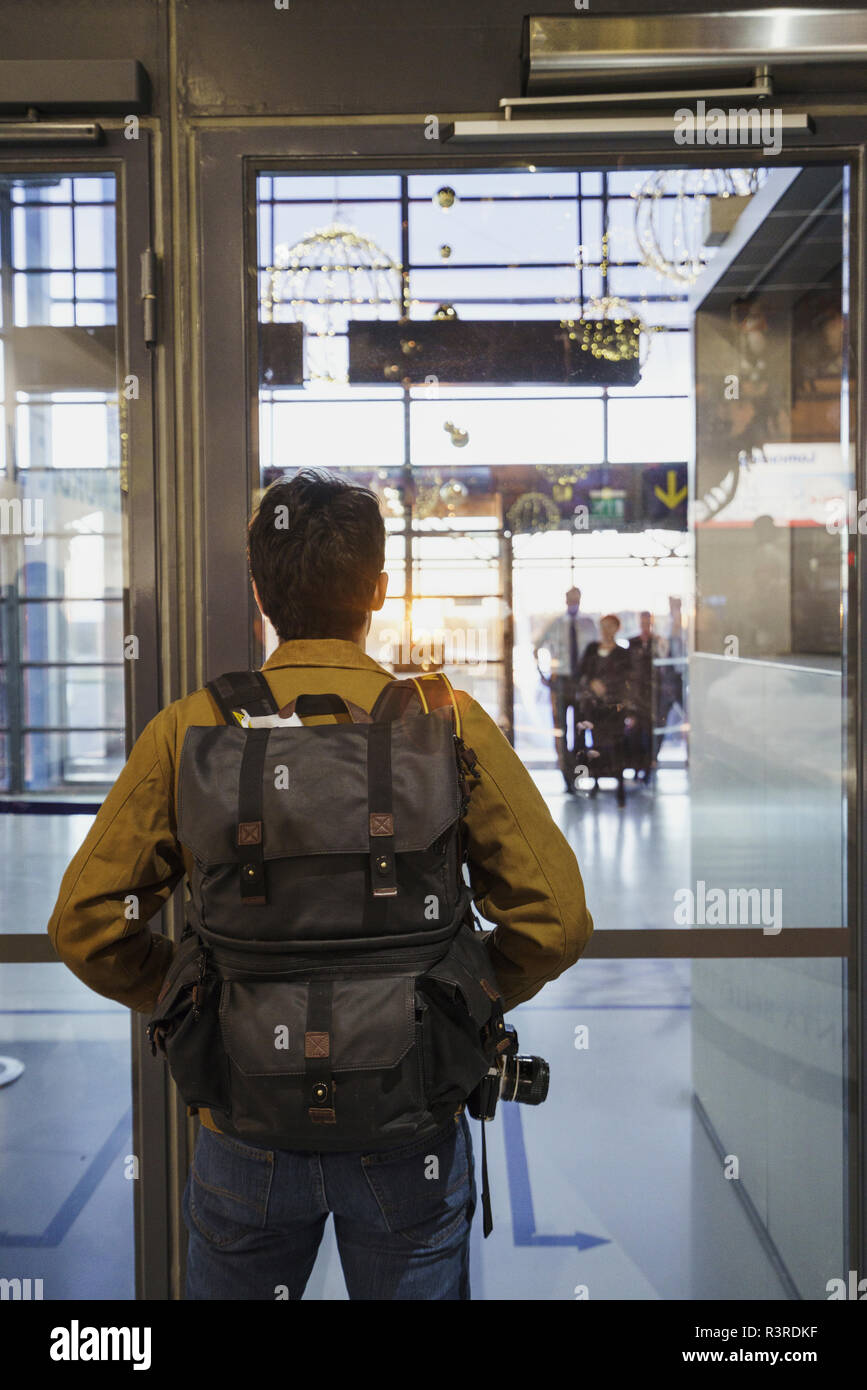 Young man with backpack standing at the airport Stock Photo