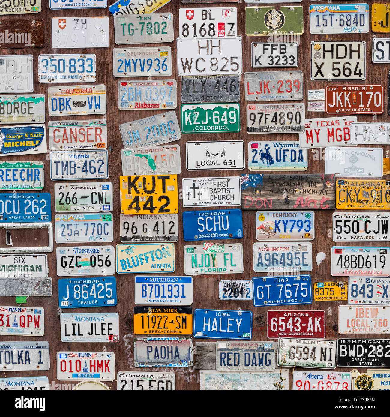 Canada, Yukon, Watson Lake. Auto license plates in The Signpost Forest
