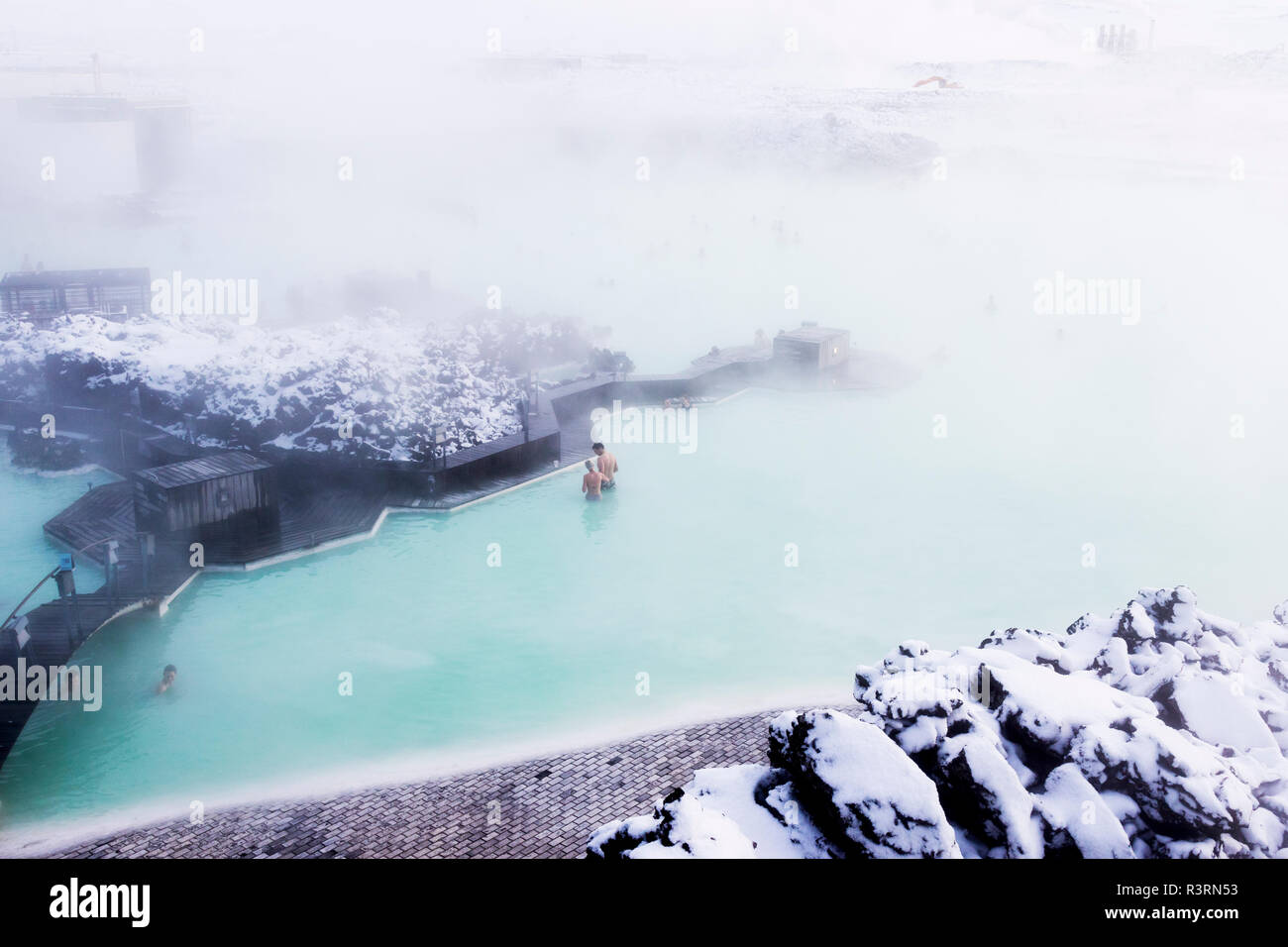 Europe, Iceland, Reykjanes Peninsula, Between Keflavik and Grindavik, Blue Lagoon. People bathing in the waters of the Blue Lagoon Spa. Stock Photo