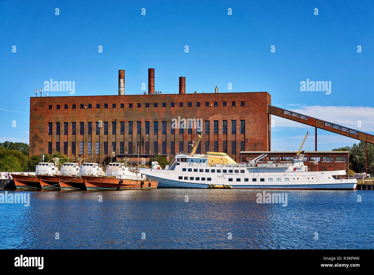 Large military boat and patrol boats in the harbor of Peenemünde. Stock Photo