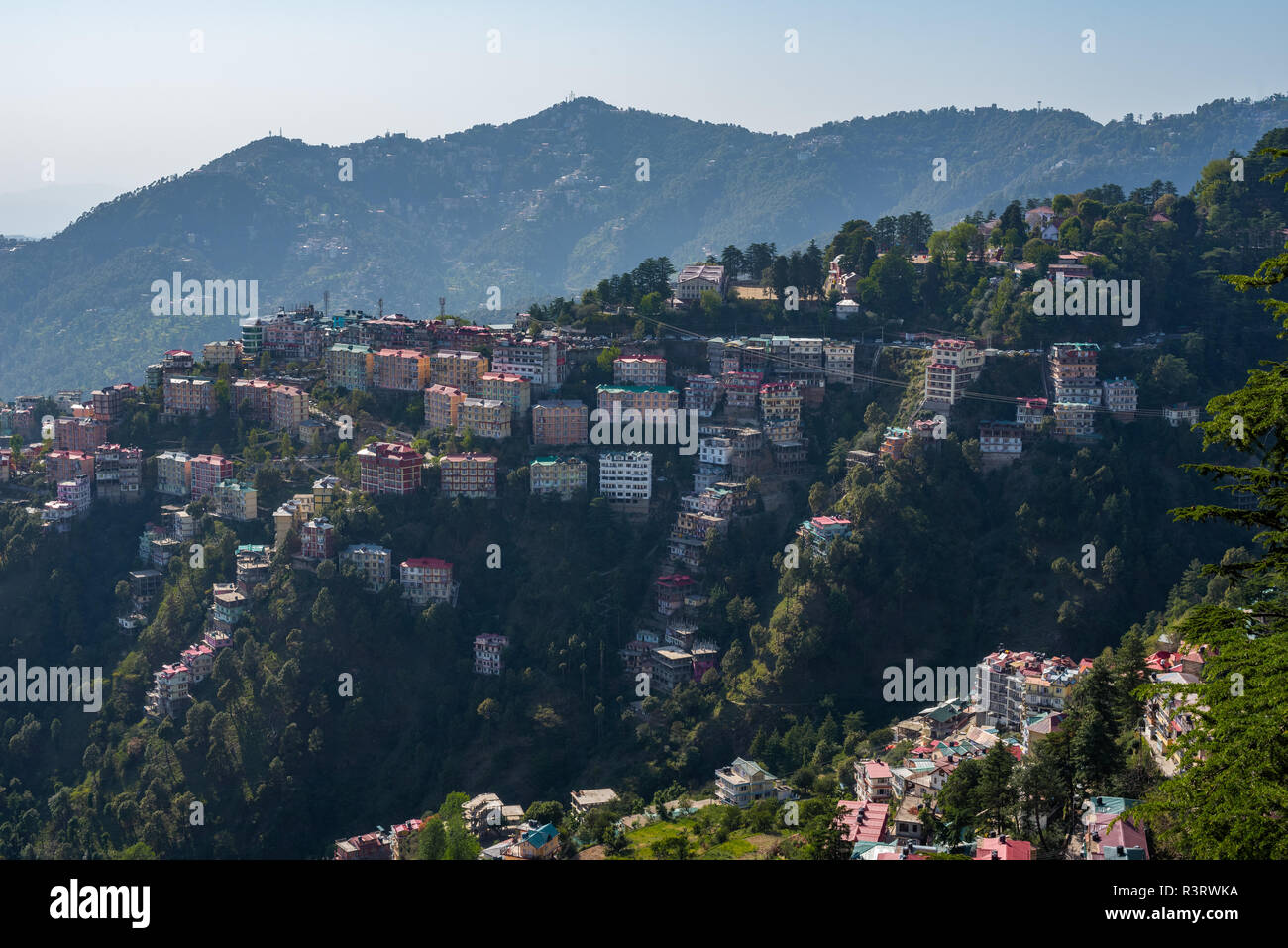 A view of houses precariously dotted around the hillside around Bishop Cotton School in Shimla, Himachal Pradesh, India Stock Photo