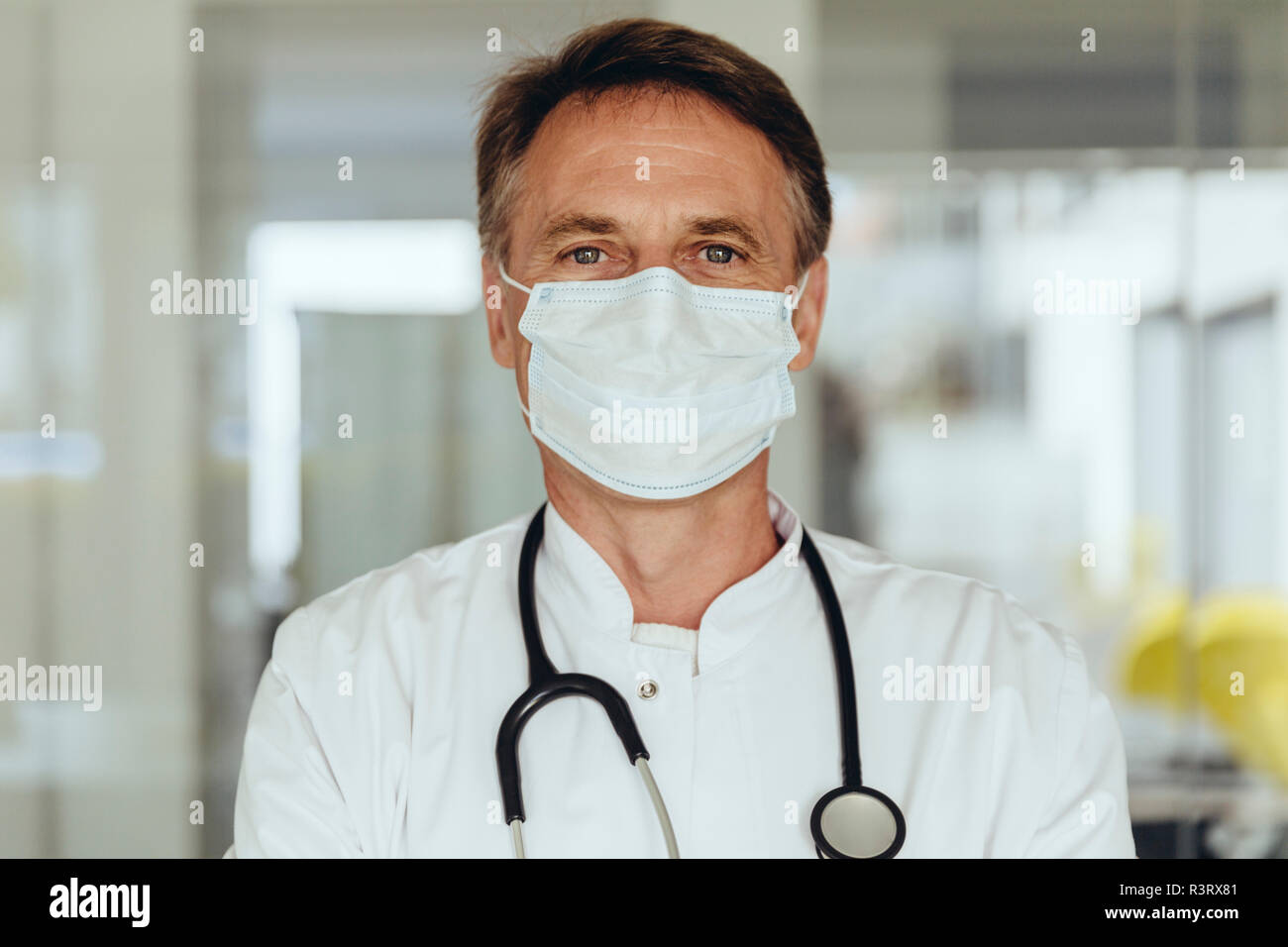 Portrait of a doctor, wearing surgical mask Stock Photo