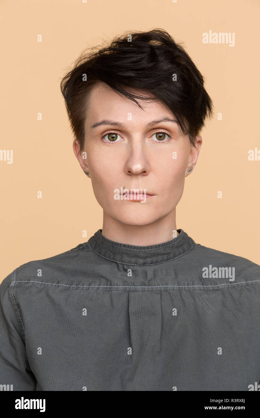 Portrait of serious woman with short hair Stock Photo