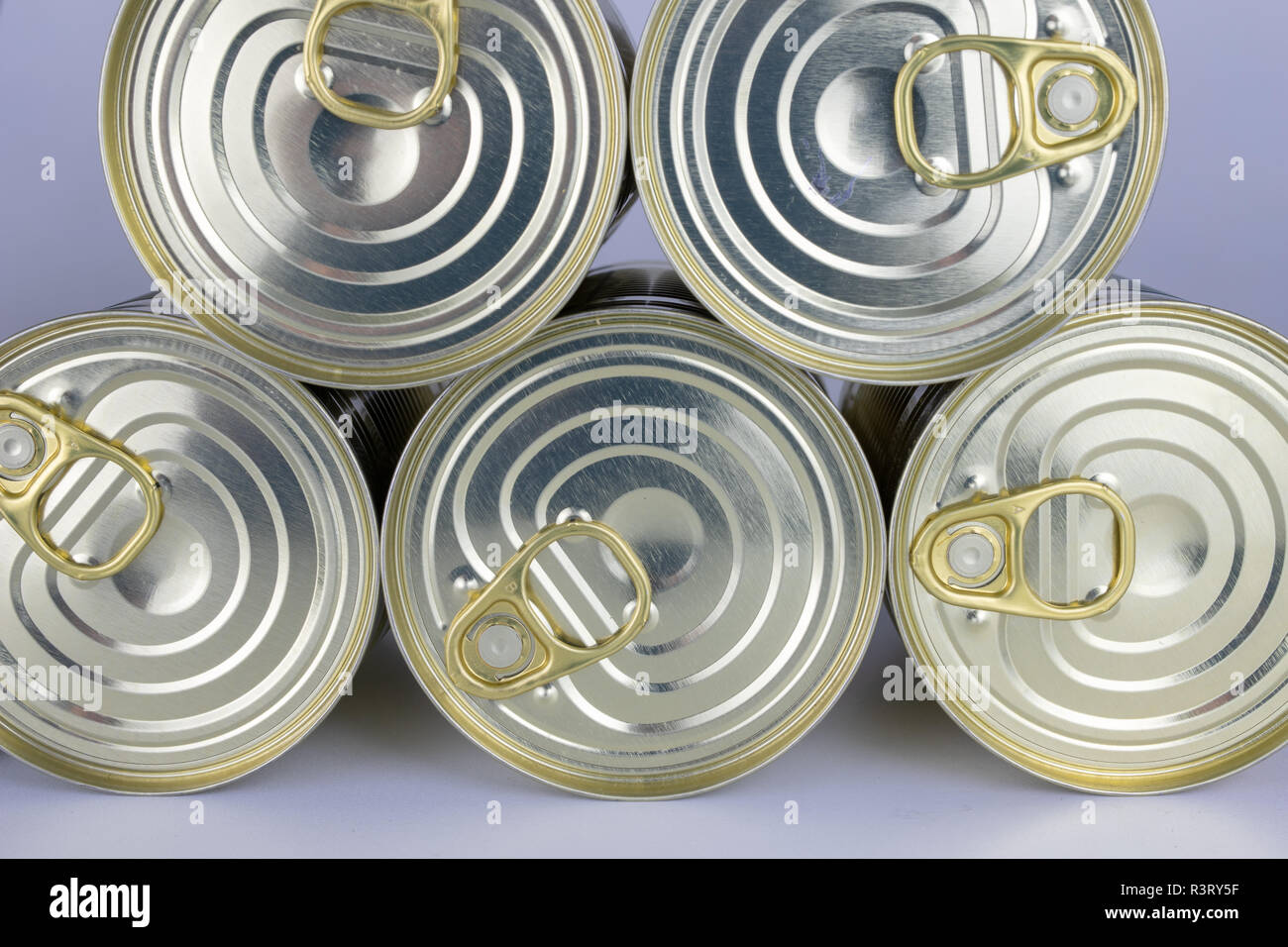 Can with meat dish on a white table. Canned food with a long shelf life