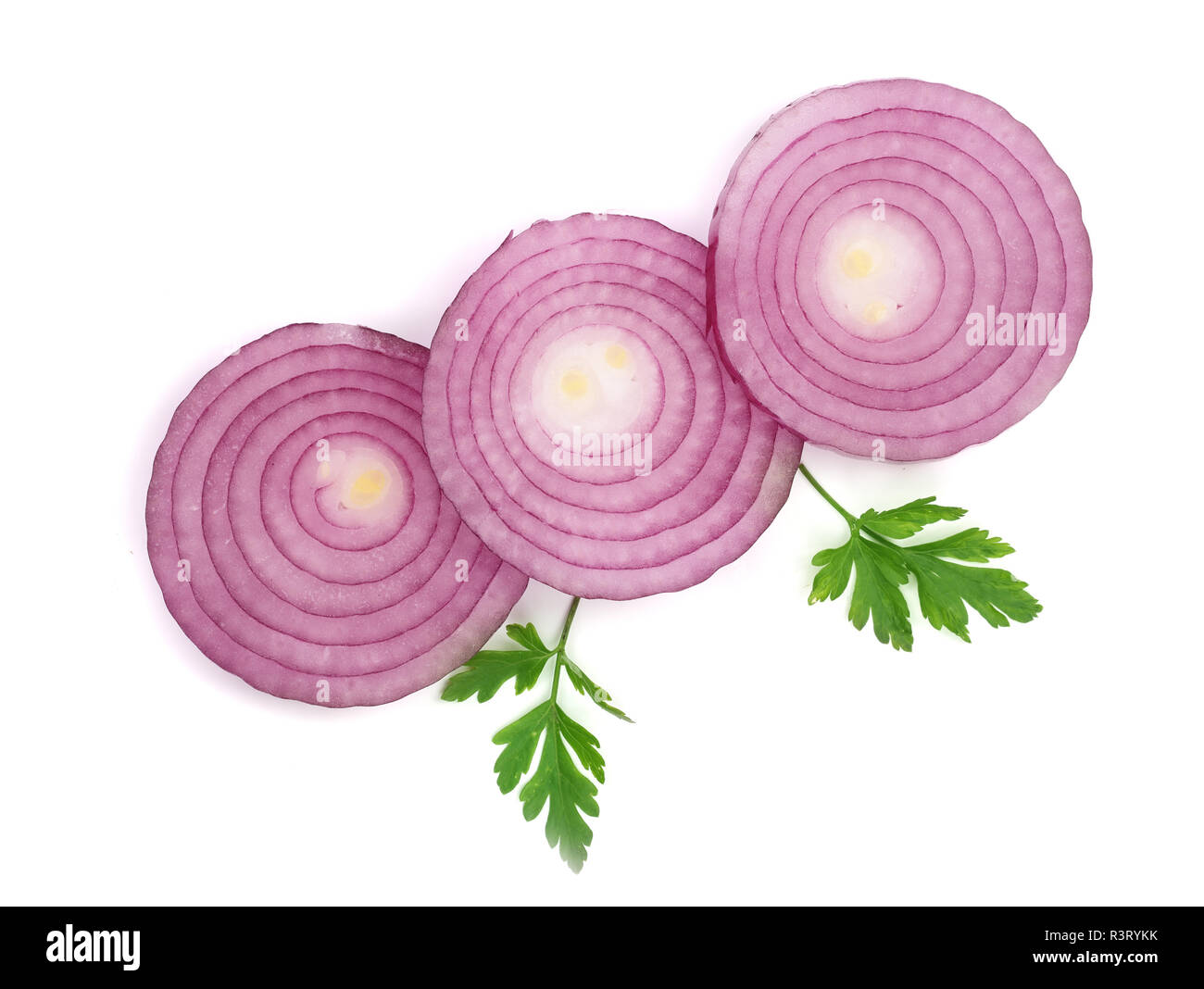 Sliced red onion rings with parsley leaves isolated on white background