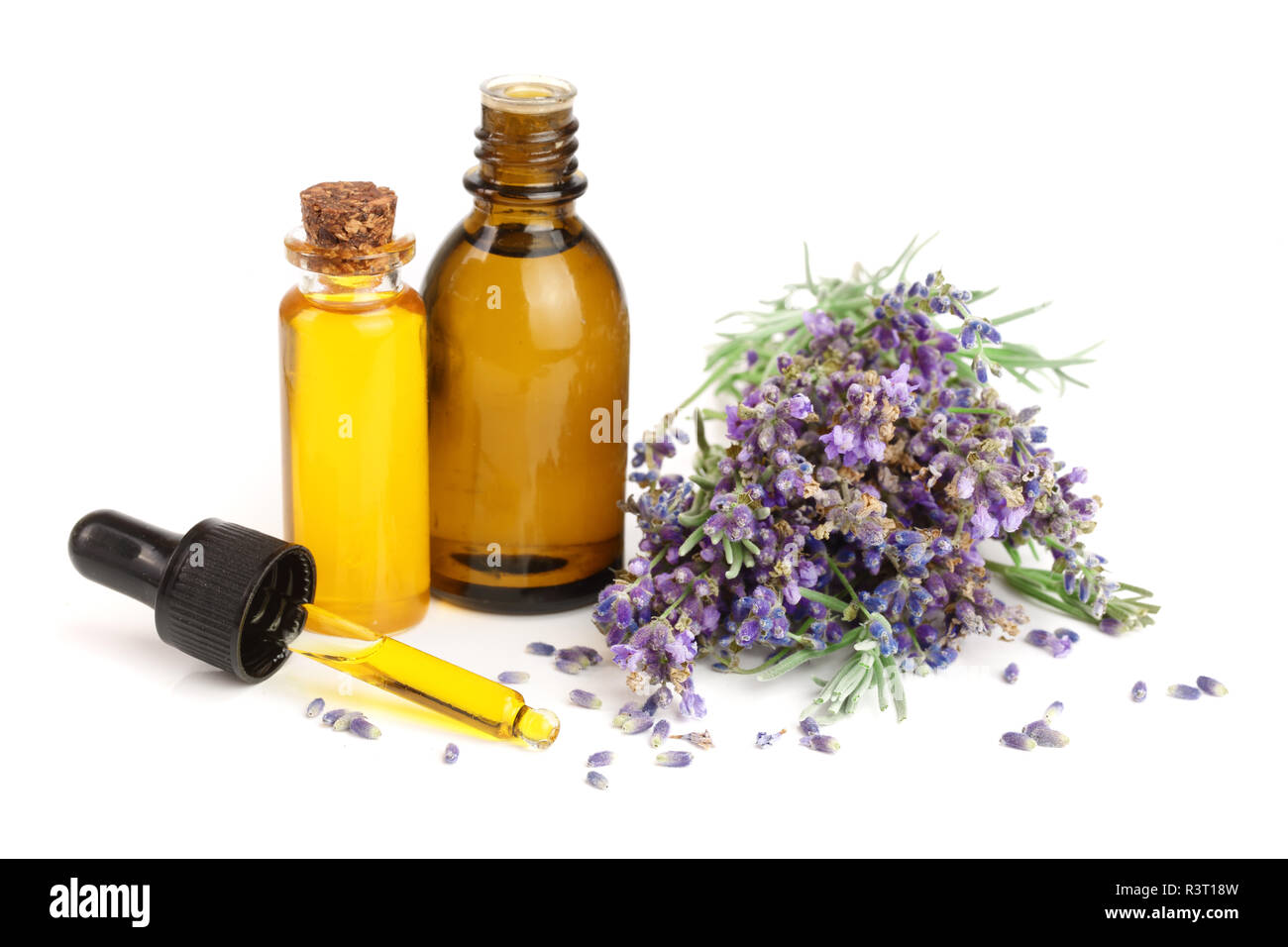 Bottle with aroma oil and lavender flowers isolated on white background ...
