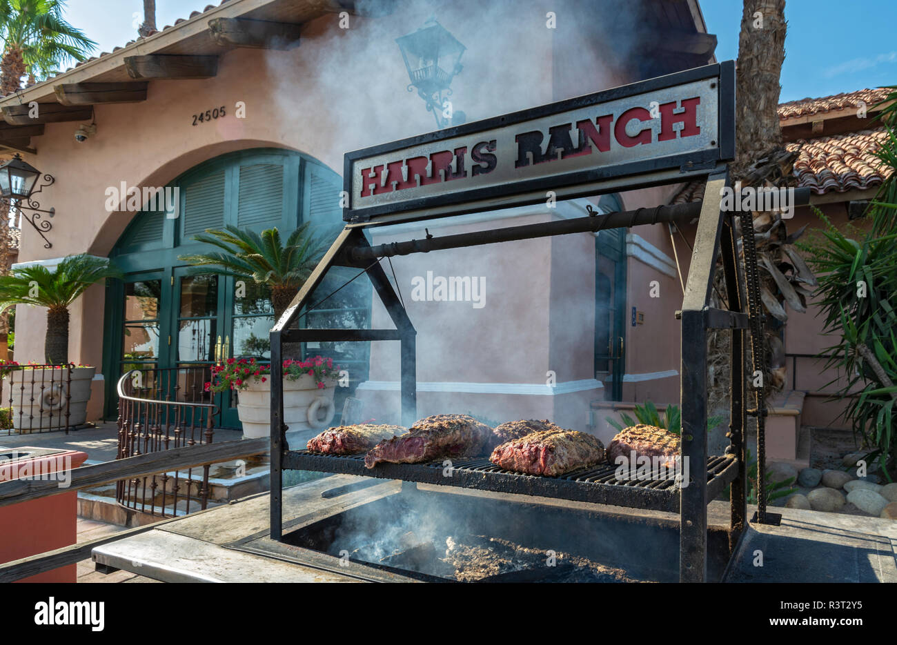 California, Coalinga, Harris Ranch Inn & Restaurant, meat on barbecue grill Stock Photo