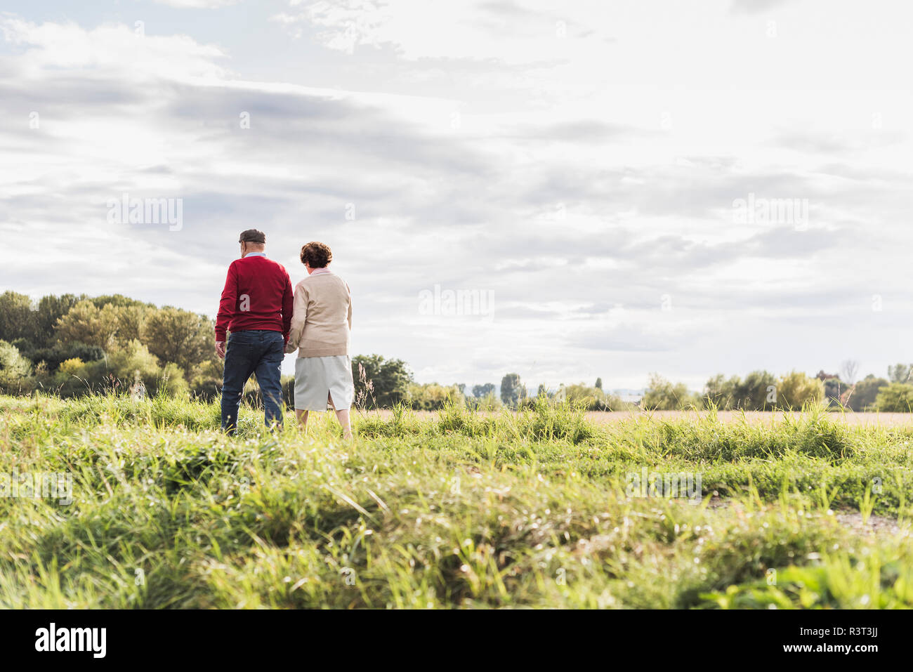Senior couple on a walk in rural landscape Stock Photo