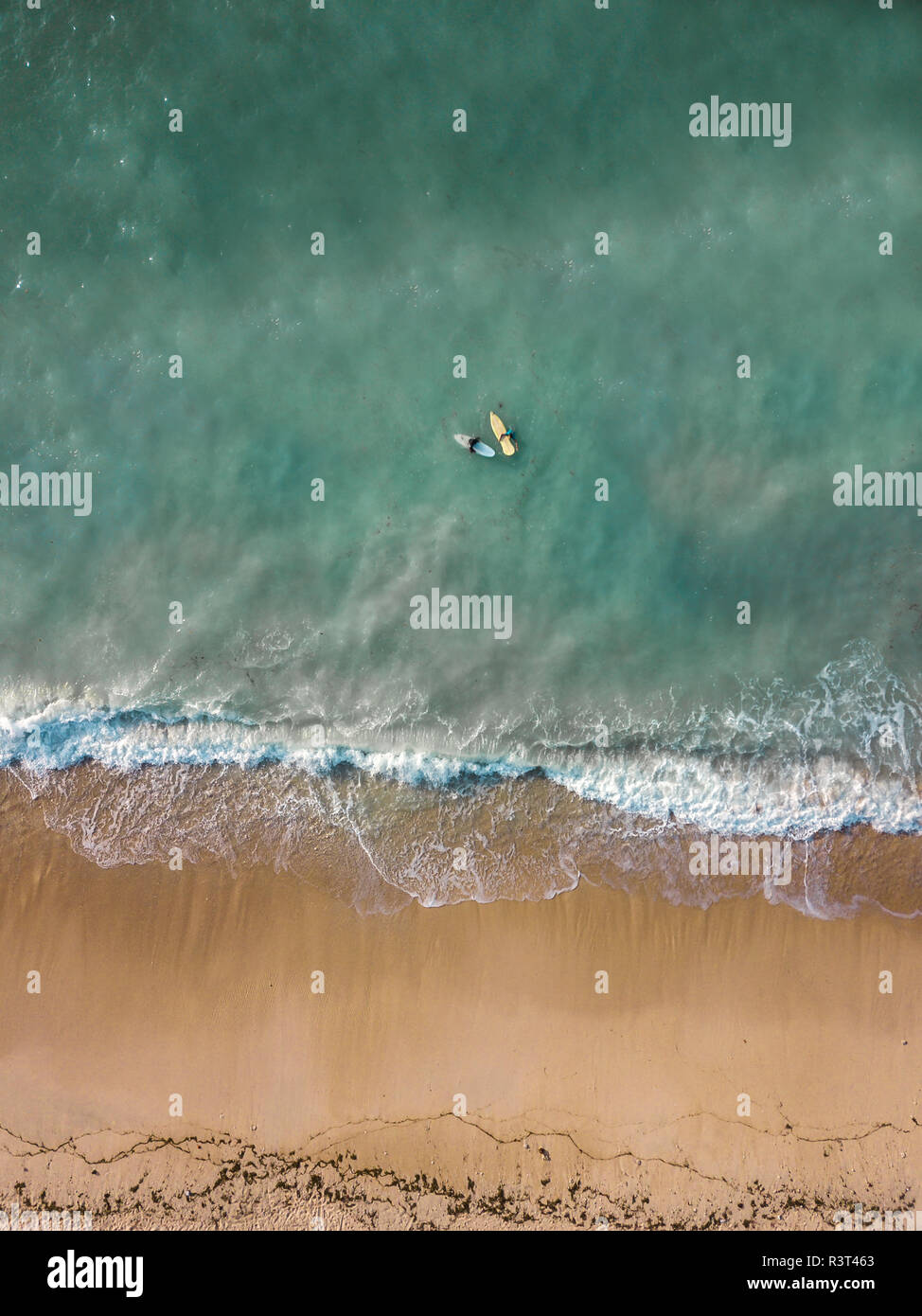 Indonesia, Bali, Aerial view of Pandawa beach, two surfers Stock Photo