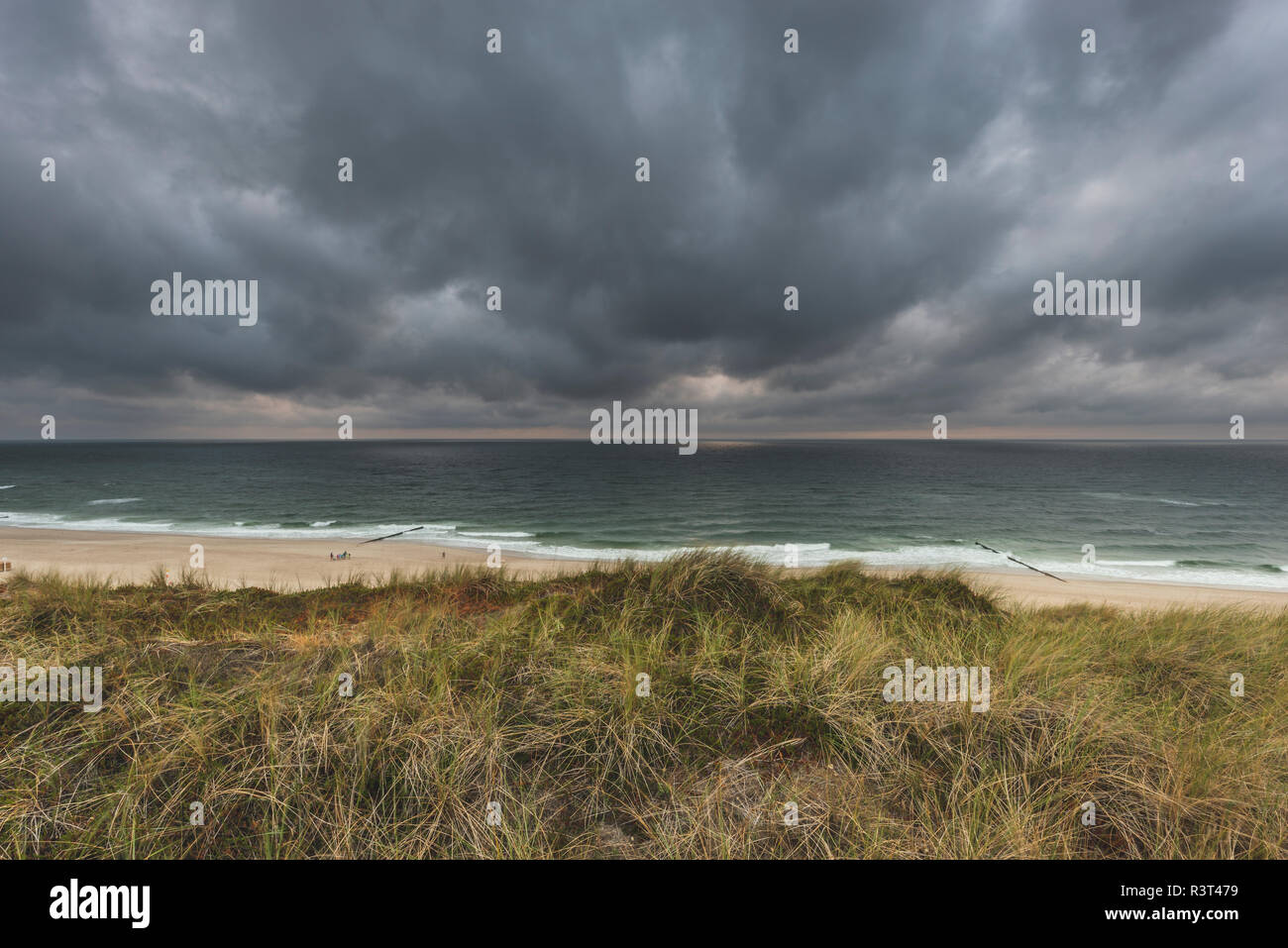 Germany, Schleswig-Holstein, Sylt, Wenningstedt, rain clouds over the beach Stock Photo