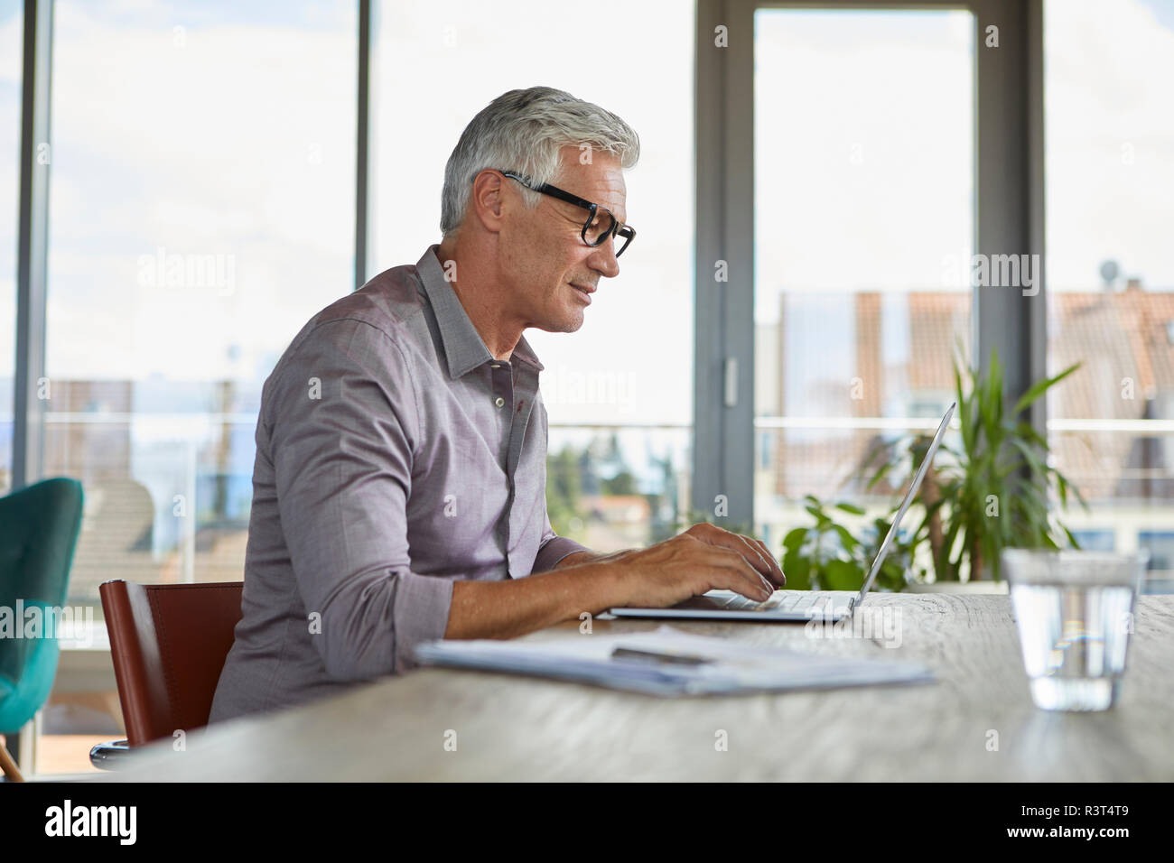 Using laptop maturehi res stock photography and images Alamy